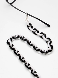 Minimalistische schwarz-weiße Brillenlkette aus Acryl mit dekorativen Harzgliedern