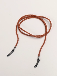 Detail of brown braided eyewear strap with silver metal tips and adjustable rubber loops