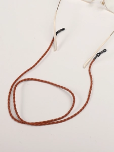 Detail of brown braided PU leather eyewear strap with non-slip silicone loops