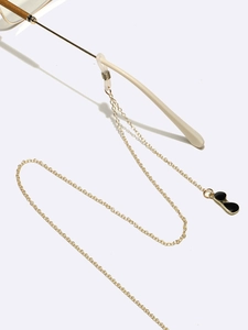 Golden metal eyewear chain featuring a mini black sunglass pendant on white background