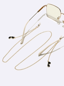 Golden anti-slip metal glasses chain featuring creative black sunglasses charms