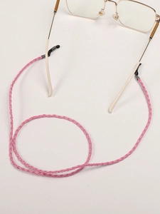 Detailed view of pink woven eyeglass chain with black rubber loops and metal buckles