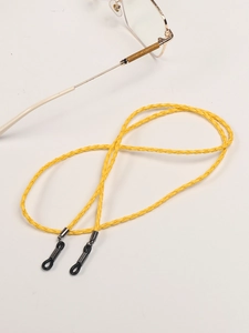 Close-up of bright yellow braided PU leather eyewear chain with silver metal connectors