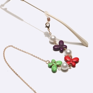 Golden eyewear chain with colorful butterflies and pearls, featuring anti-slip silicone loops