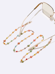 Chaîne à lunettes dorée avec breloques marguerites colorées et boucles antidérapantes