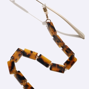 Tortoise shell acrylic eyeglass chain with gold metal links and silicone loops