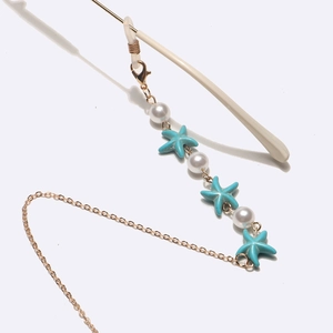 Gold glasses chain with blue starfish and white pearls for a coastal punk accessory style