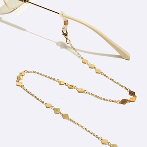 Golden metal glasses chain with geometric diamond pendants and silicone loops for women