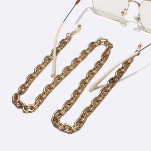 Polished gold metal eyeglass chain in flat cable design with silicone loops for glasses