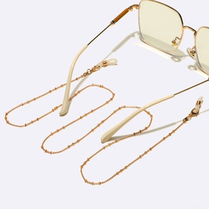Elegant gold beaded eyewear chain with non-slip silicone loops for glasses and masks