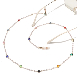 Bohemian eyewear chain with colorful crystals and pearls on a gold metal link