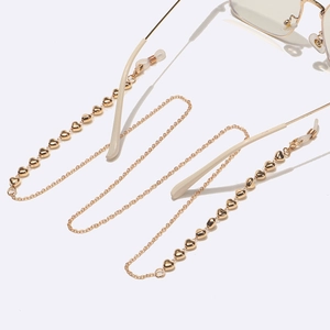 Gold metal glasses chain with heart charms and silicone loops for secure attachment