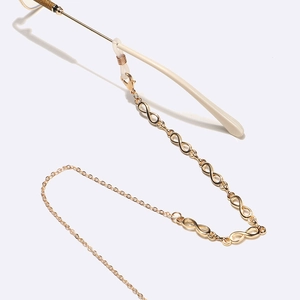 Golden infinity glasses chain with delicate metal links and clear silicone ends