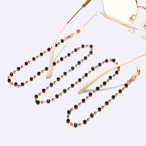 Chaîne de lunettes perles de cristal noir et détails dorés pour lunettes et masques