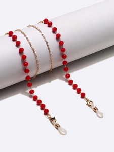 Catena per occhiali alla moda in cristallo rosso con maglie dorate e chiusure a moschettone