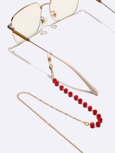Catenina per occhiali in cristallo rosso con maglie dorate e gommini in silicone
