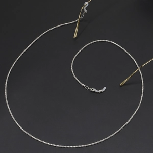 Sliver metal anti-slip eyewear chain with lobster clasps on black matte background