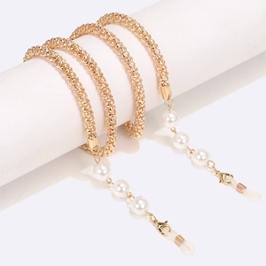 Detail of gold popcorn chain eyewear cord with white pearls and silicone loops