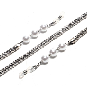 Detail of silver eyewear chain with corn link metal and elegant white pearls