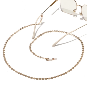 Fashionable gold metal glasses chain featuring engraved round plates and silicone loops