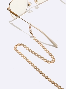 Golden oval metal link glasses chain with silicone loops on clean white background
