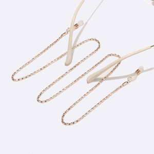 Elegant rose gold textured eyewear chain with silicone anti-slip loops on white background