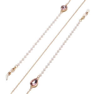 Detail of gold glasses chain with white pearls and pink teardrop crystals