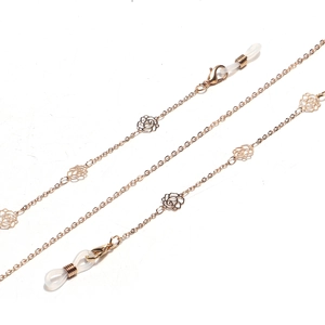 Golden eyewear chain featuring hollow rose charms and adjustable silicone loops