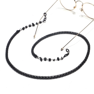 Chunky 6mm black natural stone eyewear chain with gold clips on gold round glasses