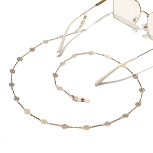Golden eyewear chain with hollow circular petals and non-slip silicone loops