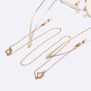 Gold-plated metal glasses chain with rhinestone heart charms and anti-slip silicone loops
