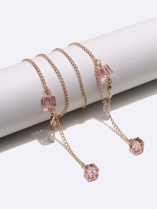 Pink square crystal eyewear chain with gold links and non-slip rubber loop ends