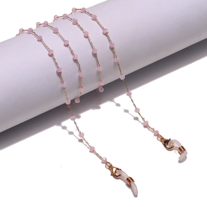 Detail of 2mm pink crystal beads and gold chain on a eyewear strap with silicone loops
