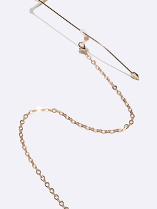 Minimalist gold metal eyewear chain with fine oval links and sleek metal bar detail