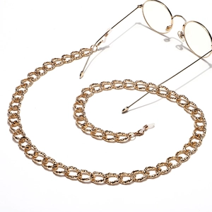 Thick golden metal eyewear chain with bold twisted links and high-gloss finish