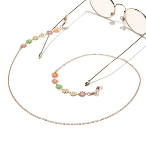 Chaîne à lunettes dorée avec fleurs émaillées colorées et boucles en silicone