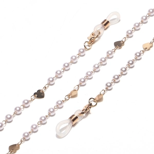 Golden eyewear chain featuring white pearls and heart charms with lobster clasps