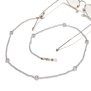 Detailed view of colorful smiley face beaded eyewear chain with silicone loops