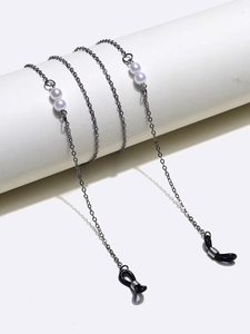 Minimalist black metal eyewear chain featuring elegant white pearls and rubber loops