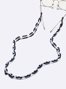 Chic black and white acrylic eyewear chain with U-shaped links and gold clips