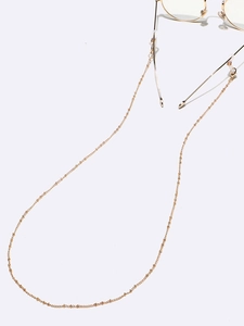 Delicate gold beaded eyeglass chain with non-slip silicone loops and lobster clasps