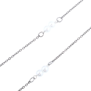 Detailed macro view of silver glasses chain with elegant double white pearls