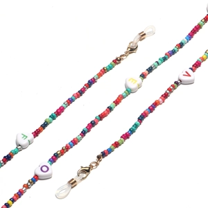 Close-up of colorful seed beads and heart LOVE charms for eyewear chains