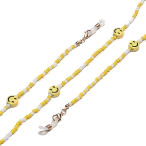 Detail of beaded glasses chain with yellow smile faces and golden lobster clasps
