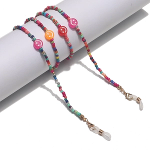 Colorful beaded eyewear and mask chain with smiley face accents and golden clasps