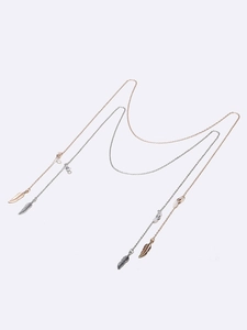 Set of two gold and silver leaf eyewear chains with feather pendants and rubber loops