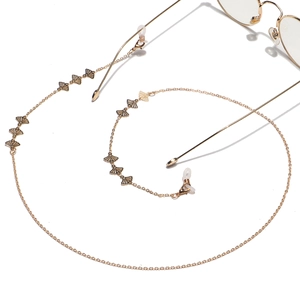 Golden fan-shaped metal eyewear chain with ginkgo leaf charms and non-slip loops