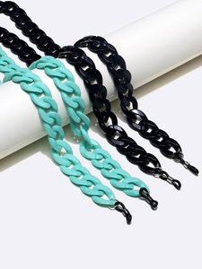 Chic 2-piece acrylic eyewear chains in glossy black and mint green with non-slip loops