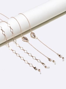 Jeu de chaînes à lunettes dorées avec maillons losanges et pendentifs en coquillage