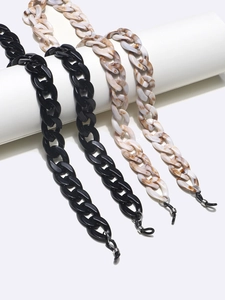Chunky acrylic glasses chains in glossy black and brown marble shell patterns set